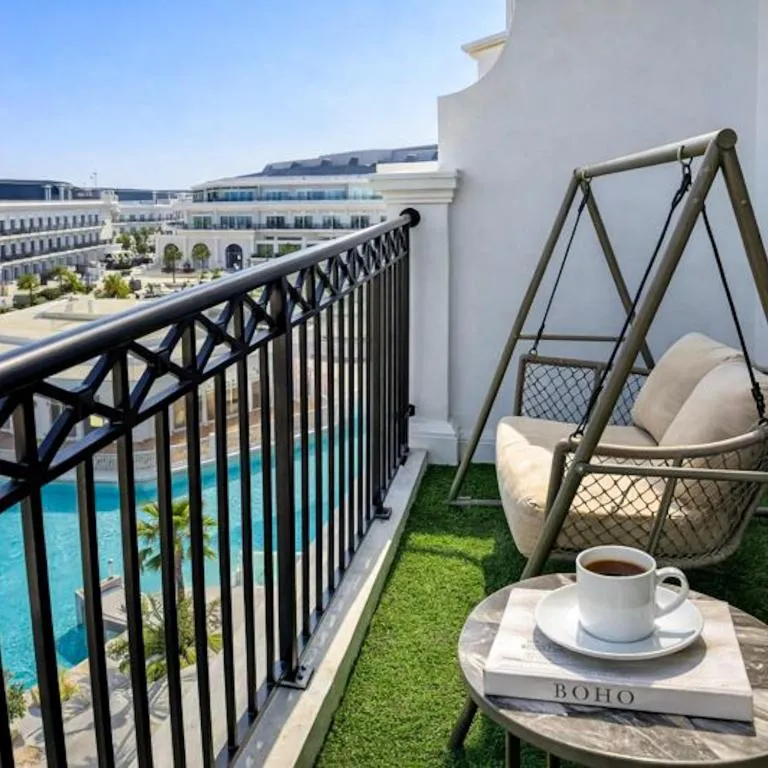 1BR Private Lagoon Resort Escape & Sunset Balcony By Green Sky Holiday Homes in Dubai balcony seating area