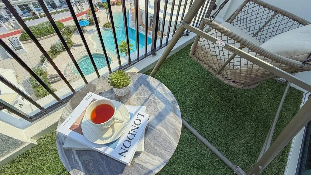 1BR Private Lagoon Resort Escape & Sunset Balcony By Green Sky Holiday Homes balcony table setup