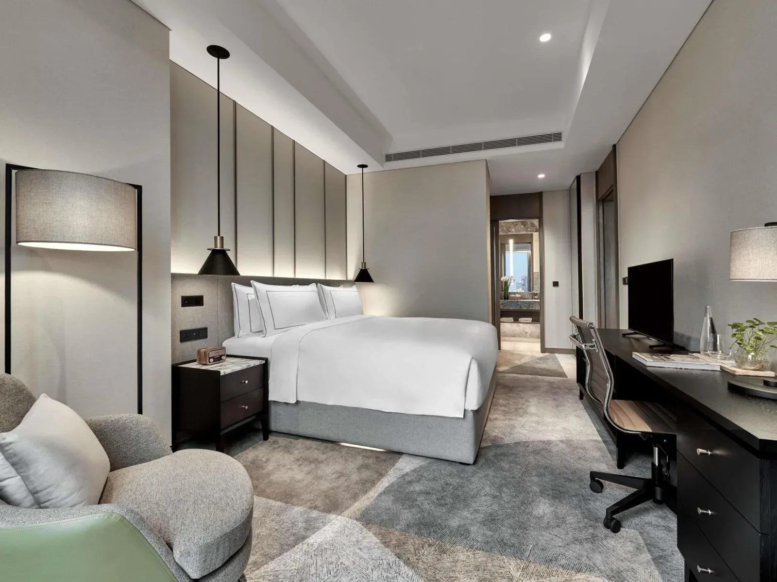 25hours Hotel Jakarta The Oddbird – Jakarta, Indonesia hotel – a bedroom with a bed and a desk and a computer at 25hours Hotel Jakarta The Oddbird in Jakarta