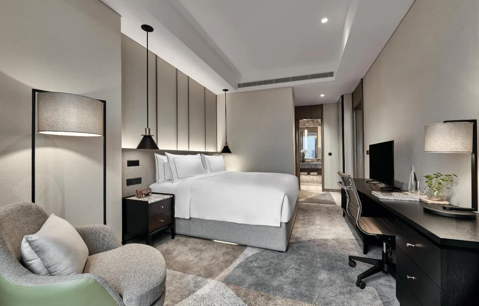 a hotel room with a bed and a desk at 25hours Hotel Jakarta The Oddbird in Jakarta