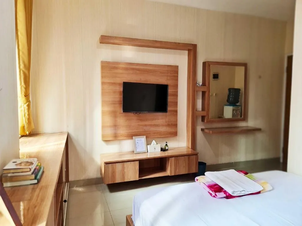 Room with TV at 37 Guesthouse Jakarta