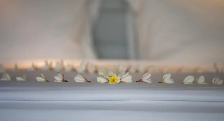 Delicate flower petals on bed at The Lombok Lodge