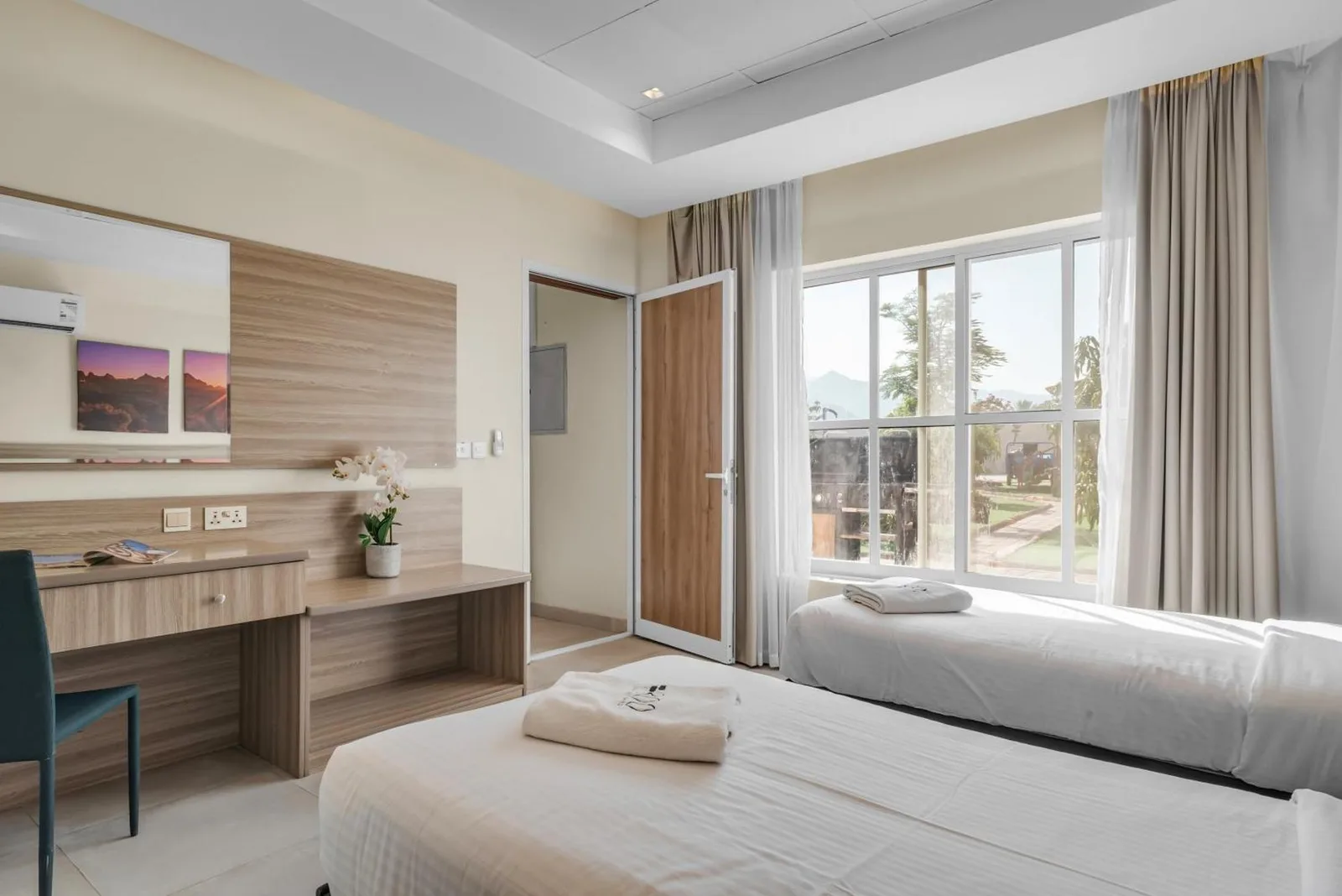Bright twin bedroom at the hotel in Fujairah