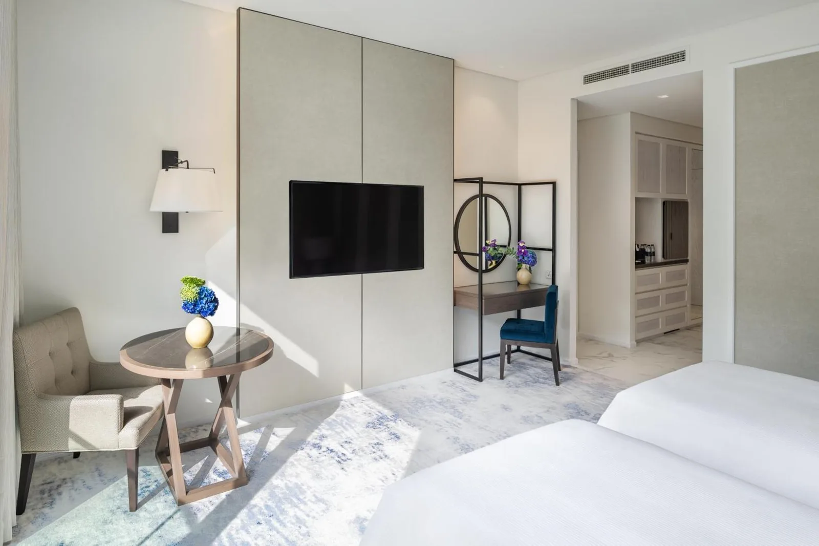 Room setup with TV and desk at Address Beach Resort Fujairah
