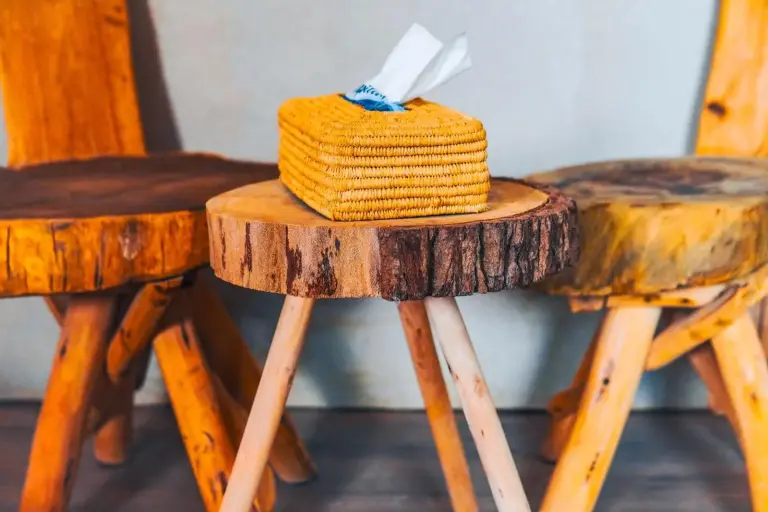 Decorative wooden stools at Aisha VIP Camp in Merzouga