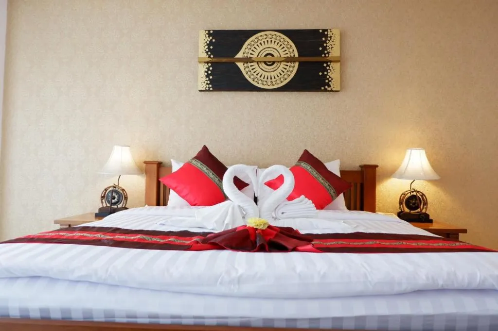 Aiyaree Place Hotel SHA PLUS romantic bed arrangement