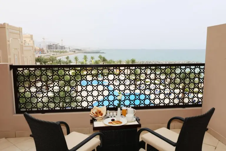 Breakfast setup on the balcony of Al Bahar Hotel & Resort