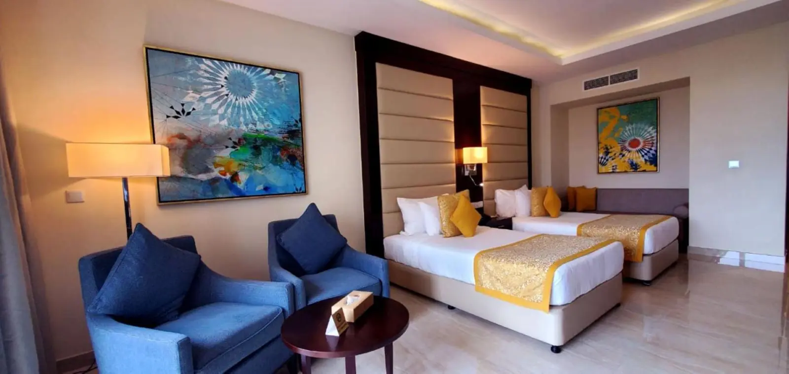 Family suite in Al Bahar Hotel & Resort with seating area
