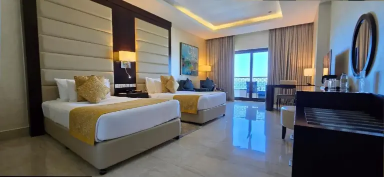 Twin room in Al Bahar Hotel & Resort with modern decor
