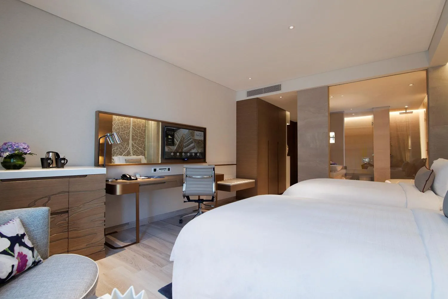Guest room with work desk and TV at Al Bandar Rotana – Dubai Creek in Dubai