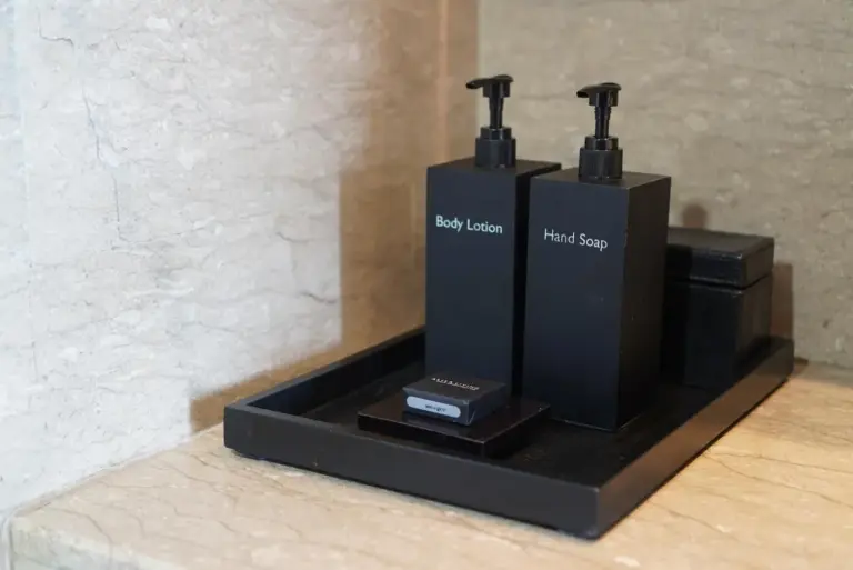 Bathroom amenities tray at Alila Solo hotel in Surakarta with body lotion and hand soap bottles