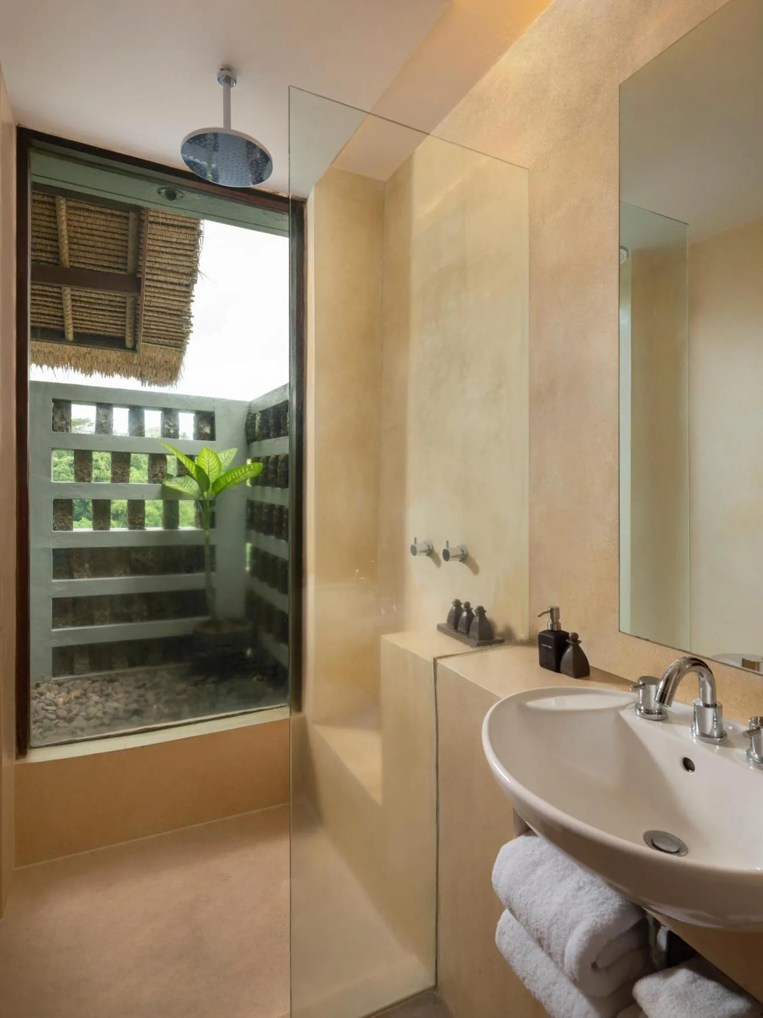 Stylish bathroom at Alila Ubud with natural light