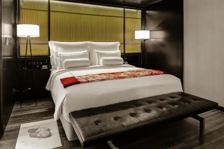 Modern bedroom in AMANOR Hotel Chiang Mai featuring elegant furnishings