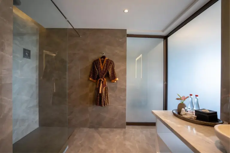 Modern bathroom at Amaranta Prambanan Yogyakarta with vanity, shower, and stone finishes.