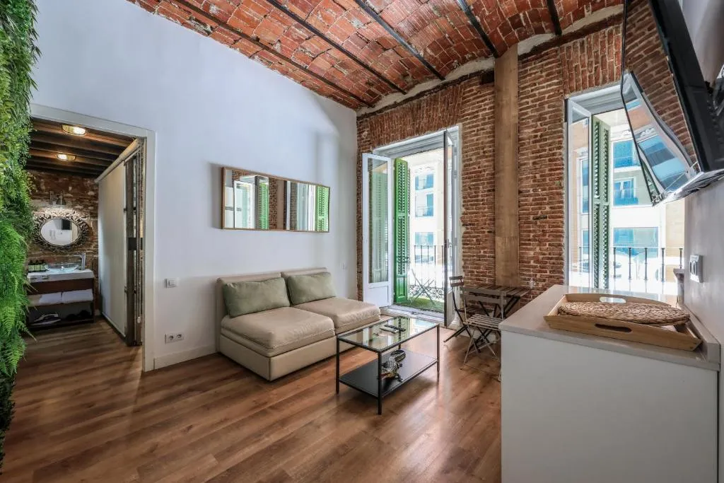 Bright living room at AmazINN Places Madrid Preciados
