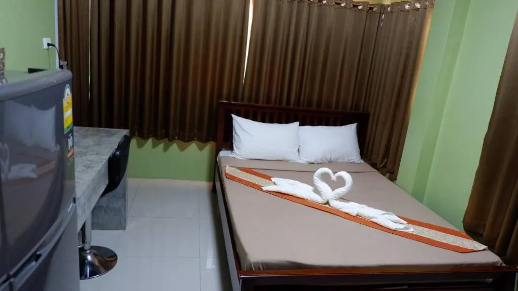 Comfortable bedroom setup at Amazon Resort, Surat Thani