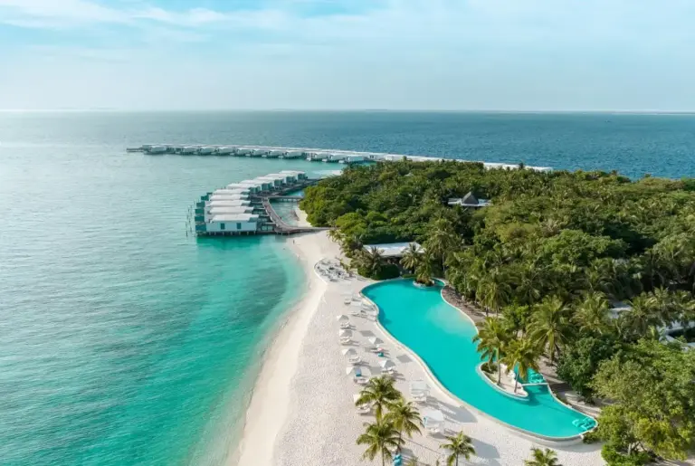 Aerial view of Amilla Maldives showcasing the beach and villas