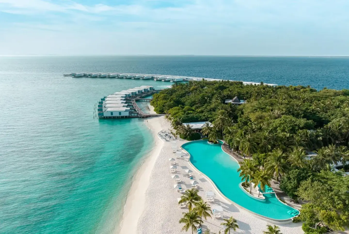 Aerial view of Amilla Maldives showcasing the beach and villas