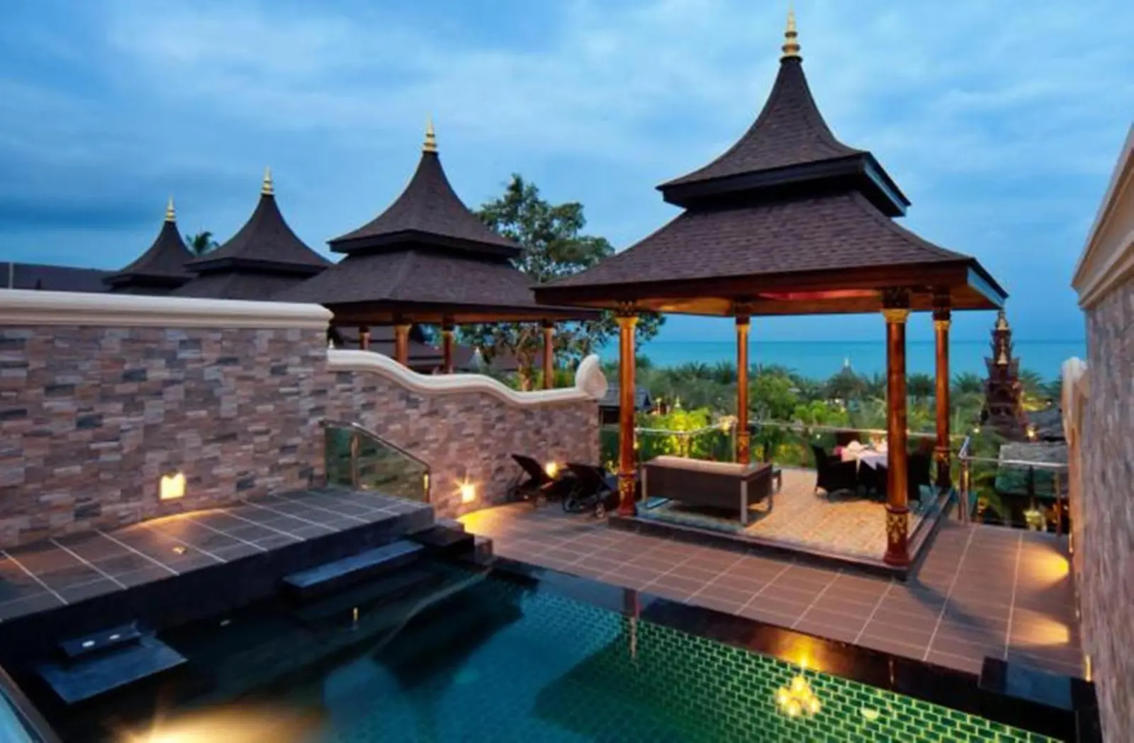 Evening view of the pool area at Ammatara Pura Pool Villa in Koh Samui