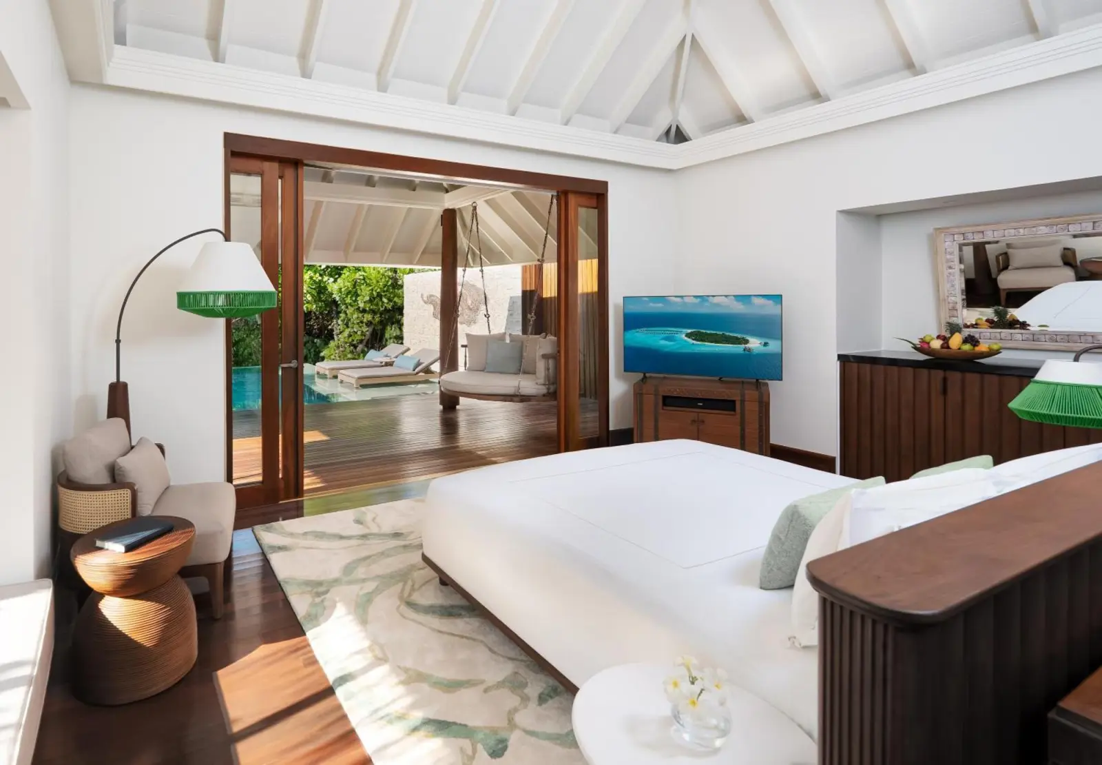 Inside view of the bedroom at Anantara Kihavah Maldives Villas featuring modern decor.
