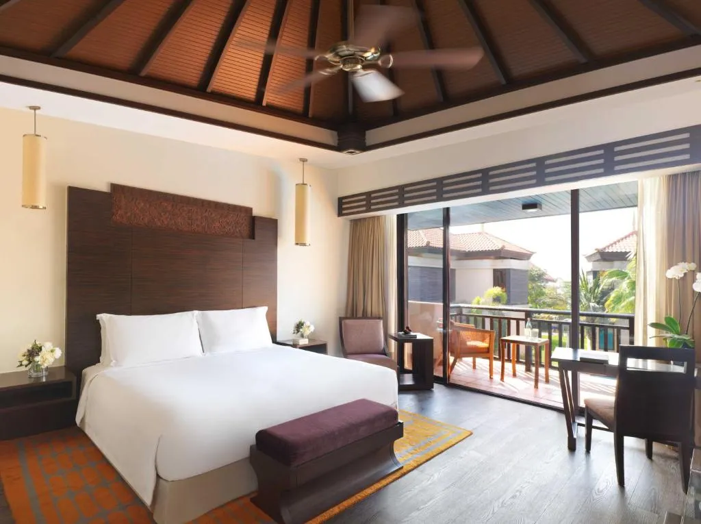 Spacious bedroom in Anantara The Palm Dubai Resort with modern amenities.