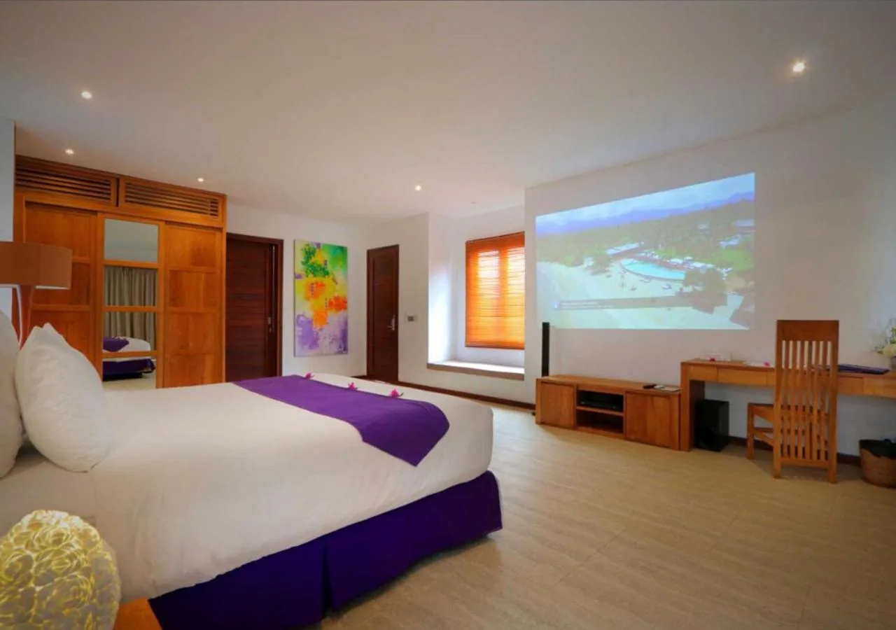 Modern villa room at Anema Wellness Villa & Spa with projection screen