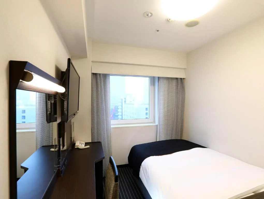 Einzelzimmer für Gäste im APA Hotel Akasaka Mitsuke