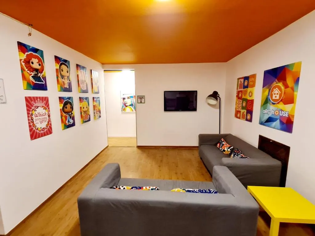 Arc House Madrid common area with art and seating