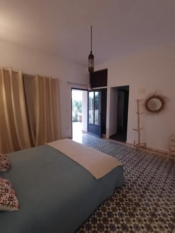 Artgana Lodge inviting bedroom with natural light