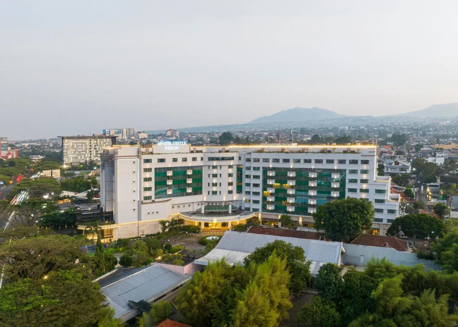 Exterior view of ARTOTEL Suites Aquila Bandung in Bandung with the hotel building and city skyline in the background