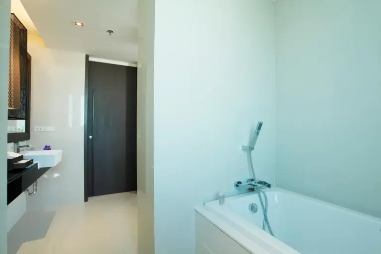 Bathroom with bathtub and sink area at Avani Khon Kaen Hotel & Convention Centre, designed in a minimalist style.