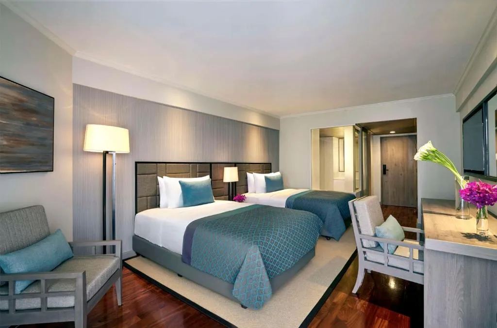 Chambre double Avani Pattaya Resort avec des lits confortables