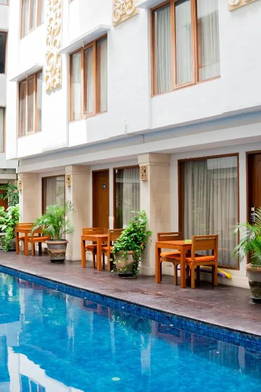 Dining area by the pool at Bali Sun Tropical Hotel & Spa