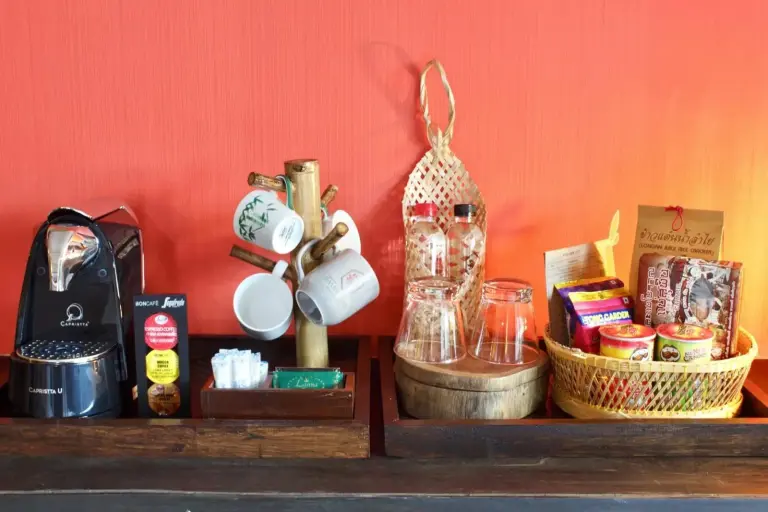 Bamboori Boutique Resort Chiang Mai in-room coffee and snack station with cups and basket amenities