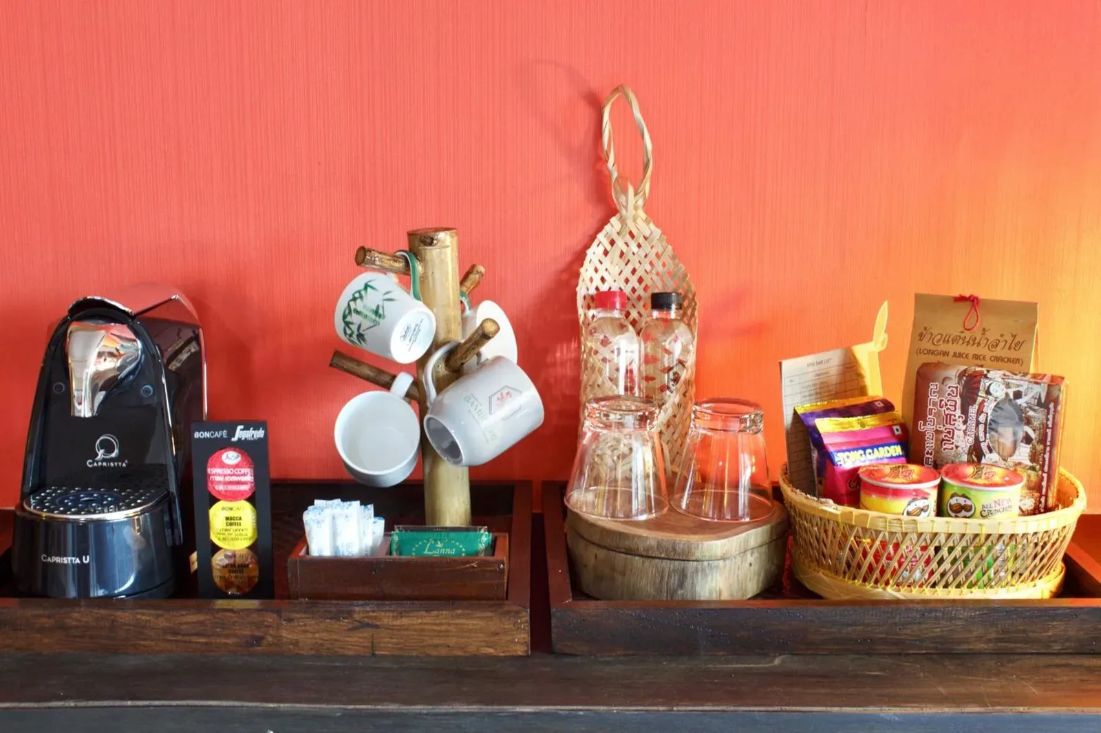 Bamboori Boutique Resort Chiang Mai in-room coffee and snack station with cups and basket amenities