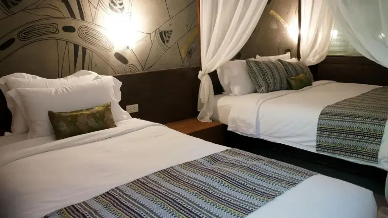 Bamboori Boutique Resort Chiang Mai twin bedroom with neatly made beds and patterned runners