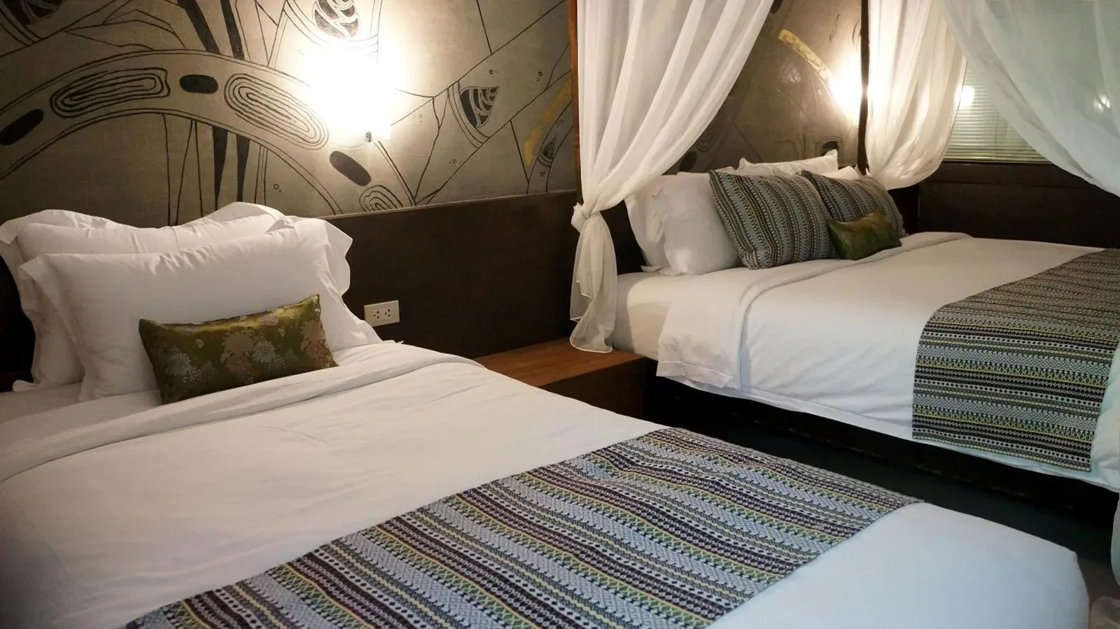 Bamboori Boutique Resort Chiang Mai twin bedroom with neatly made beds and patterned runners