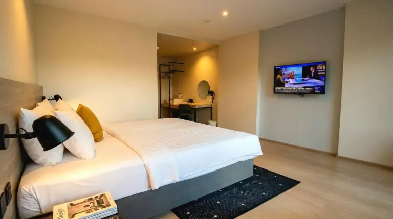 Bedroom interior at Beehive Boutique Hotel Phuket in Phuket with TV and desk area