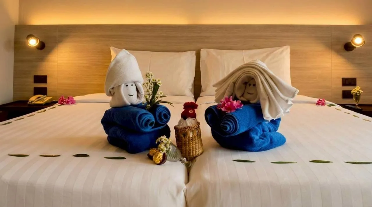 Towel art on the bed in a guest room at Beehive Boutique Hotel Phuket in Phuket