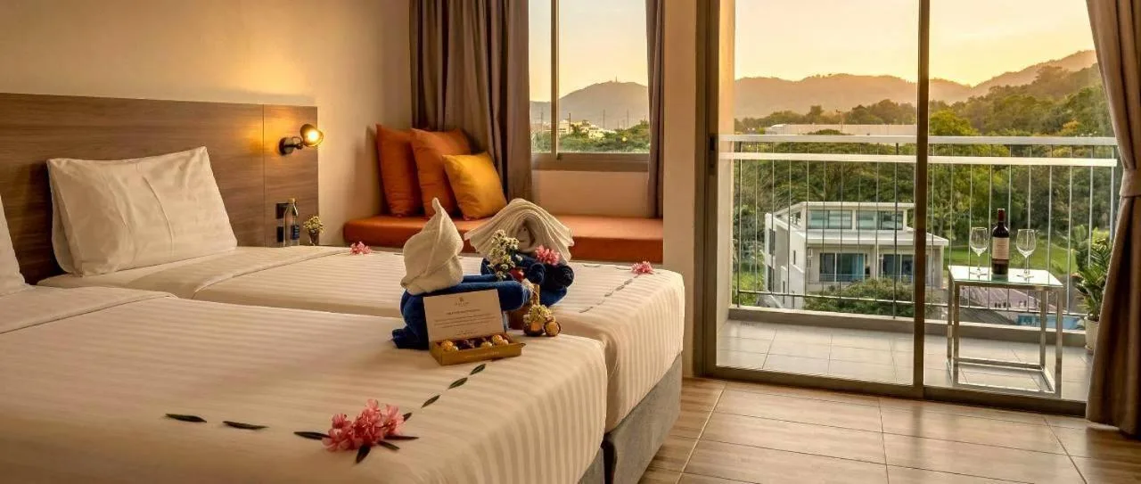 Twin bed guest room at Beehive Boutique Hotel Phuket in Phuket with balcony mountain view