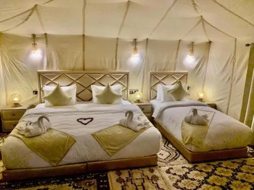 Comfortable bedroom in Berber luxury camp tent