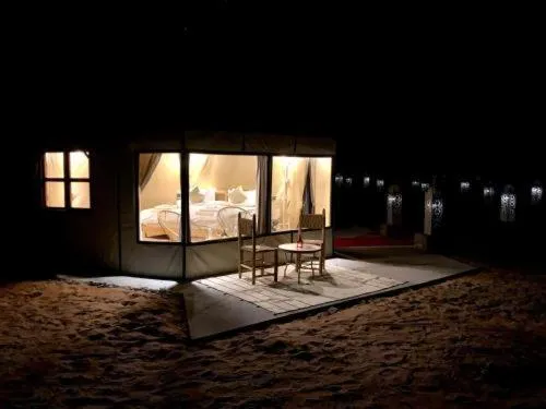 Berber luxury camp tent illuminated at night