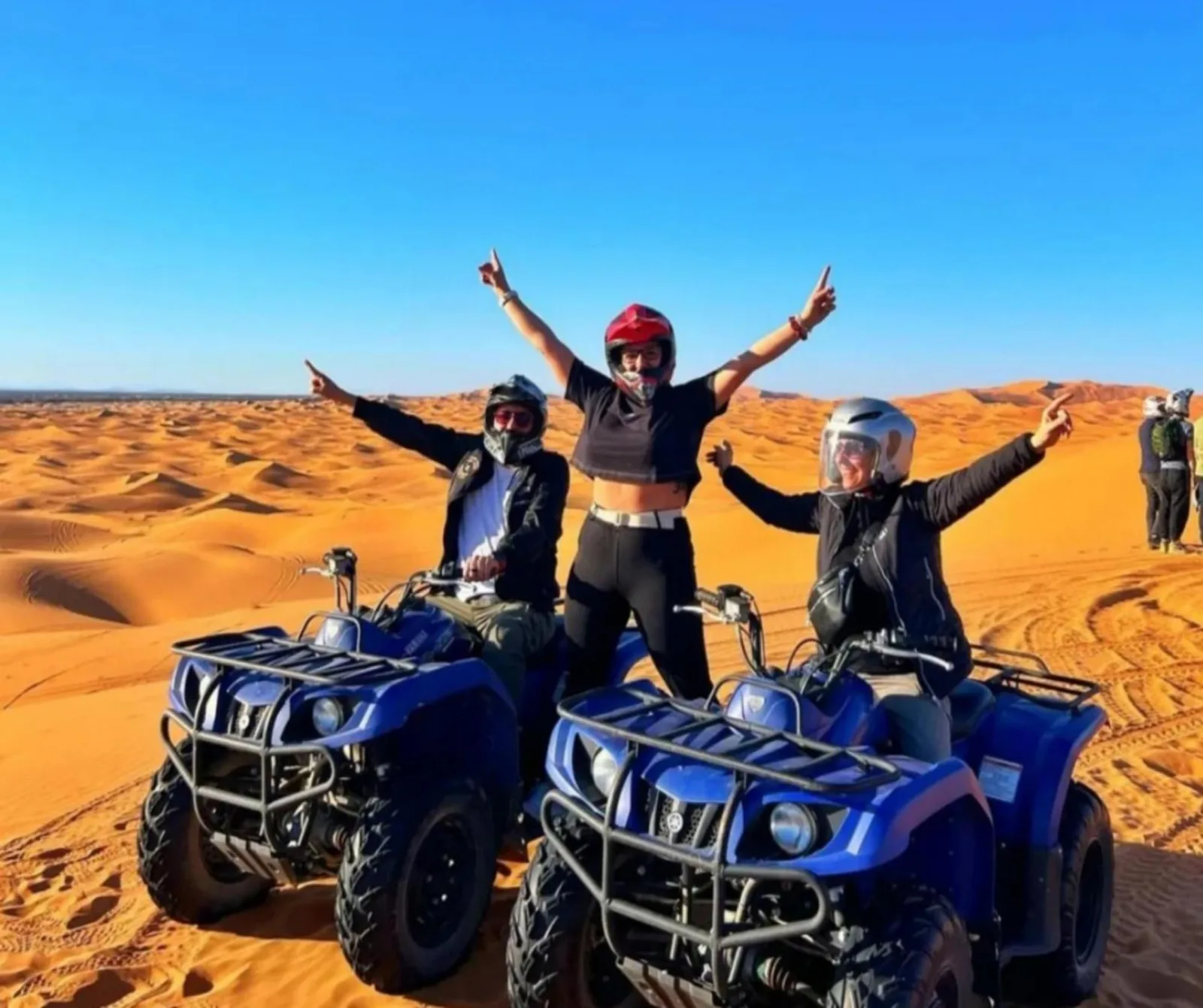 Best Classic Sahara Experiences in Merzouga guests on quad bikes in the desert dunes