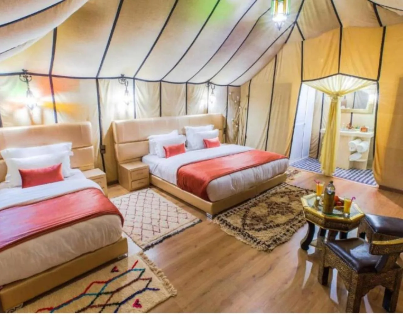 Best Classic Sahara Experiences in Merzouga twin bed tent room with rugs and seating area