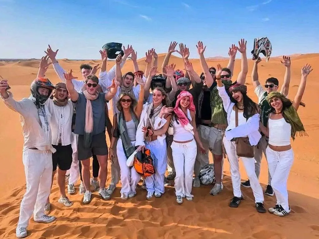 Group celebration at Big Dipper Luxury Camp in Merzouga