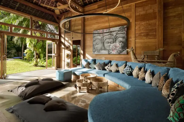 Cozy living room with blue seating at Blue Karma Village