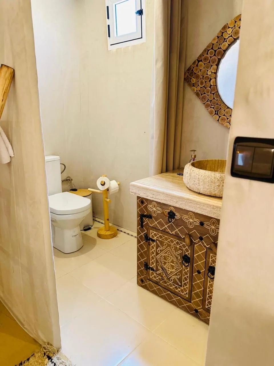 Bathroom vanity and toilet inside Brilliant luxury camp in Merzouga luxury tent