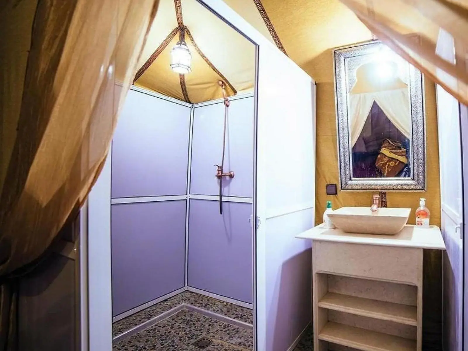 Shower area of a tent bathroom at Camel Trekking Camp, Merzouga
