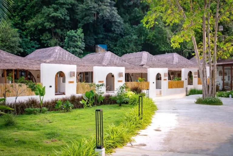 Exterior view of Cape Beach Villa Samui featuring charming cottages