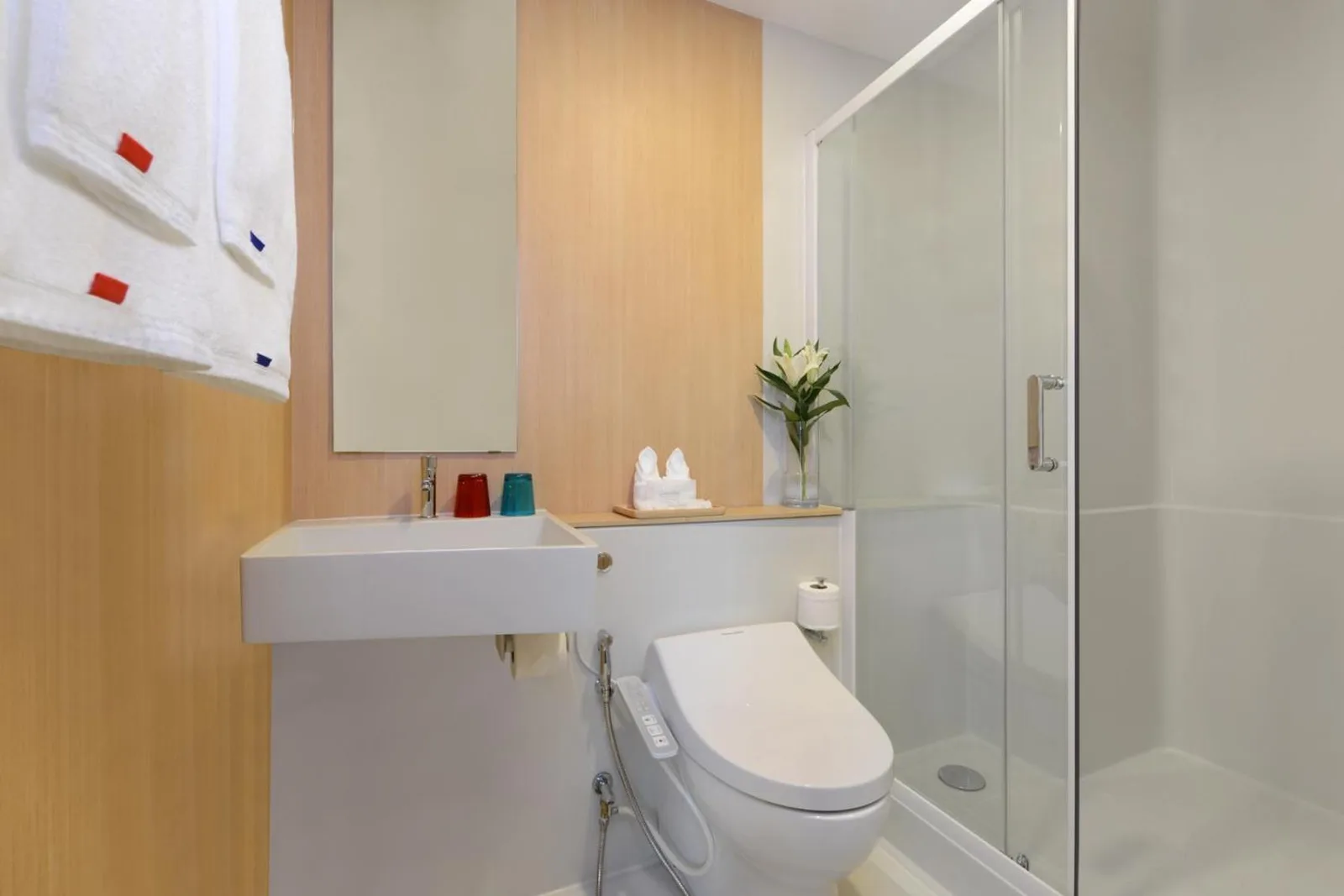 Bathroom at Centre Point Prime Hotel Pattaya with shower, sink, and toilet